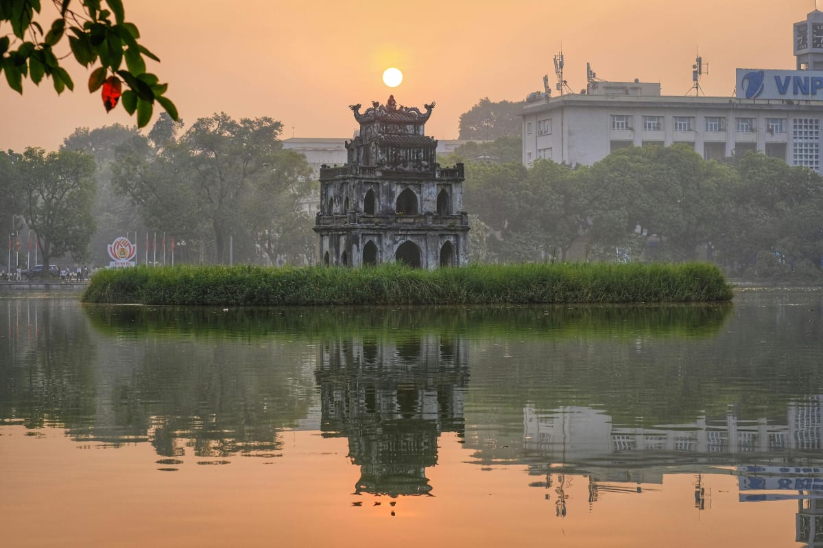 Tortoise Tower on Hoan Kiem Lake at sunset Hanoi