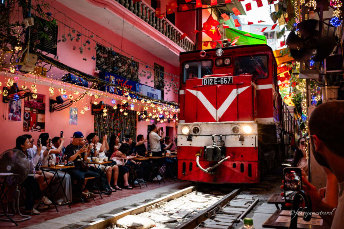 Train passing through Train Street in Hanoi