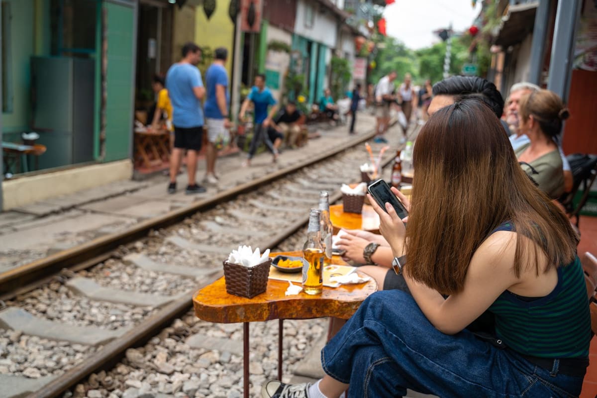 Café on Train Street in Hanoi with chairs set up along the tracks