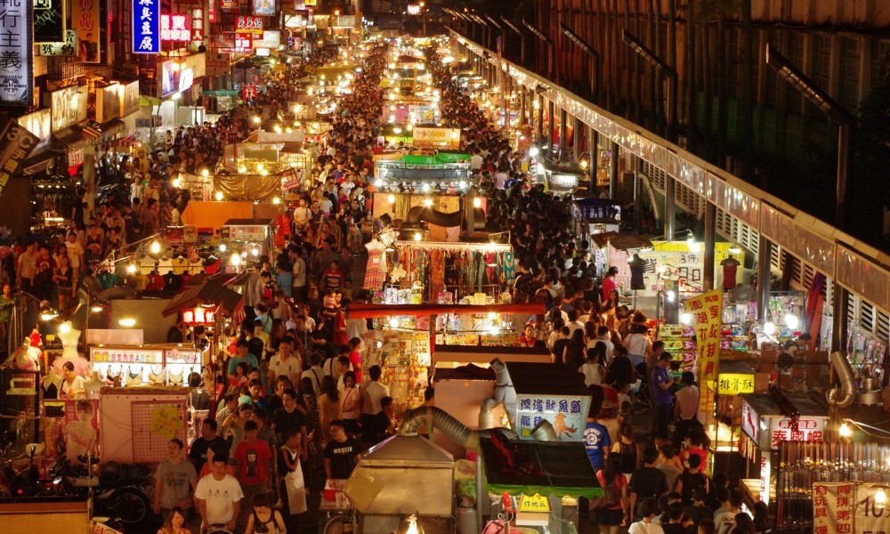Hanoi Night Market - busy stalls with colorful lanterns