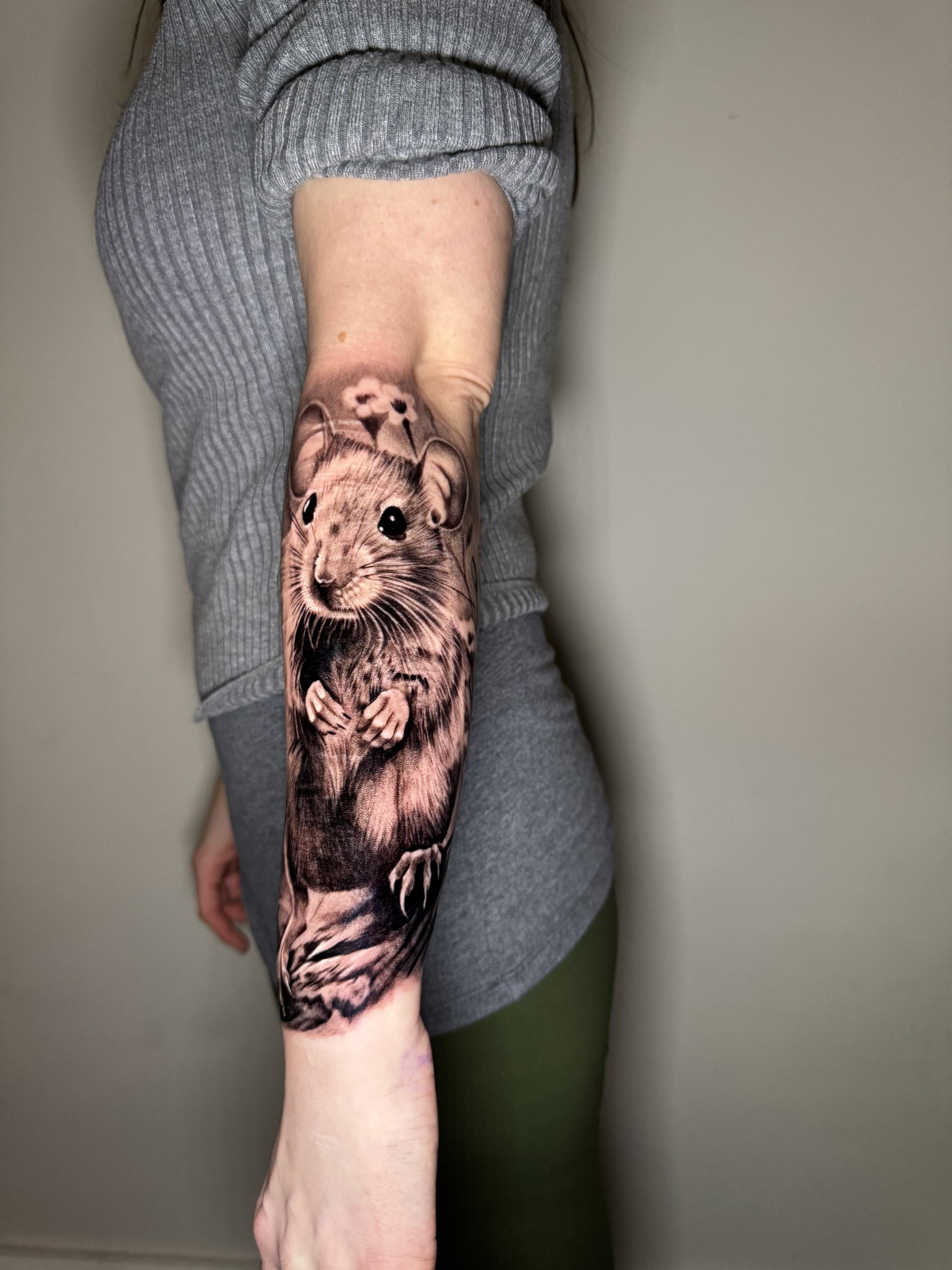 Realistic rat on forearm