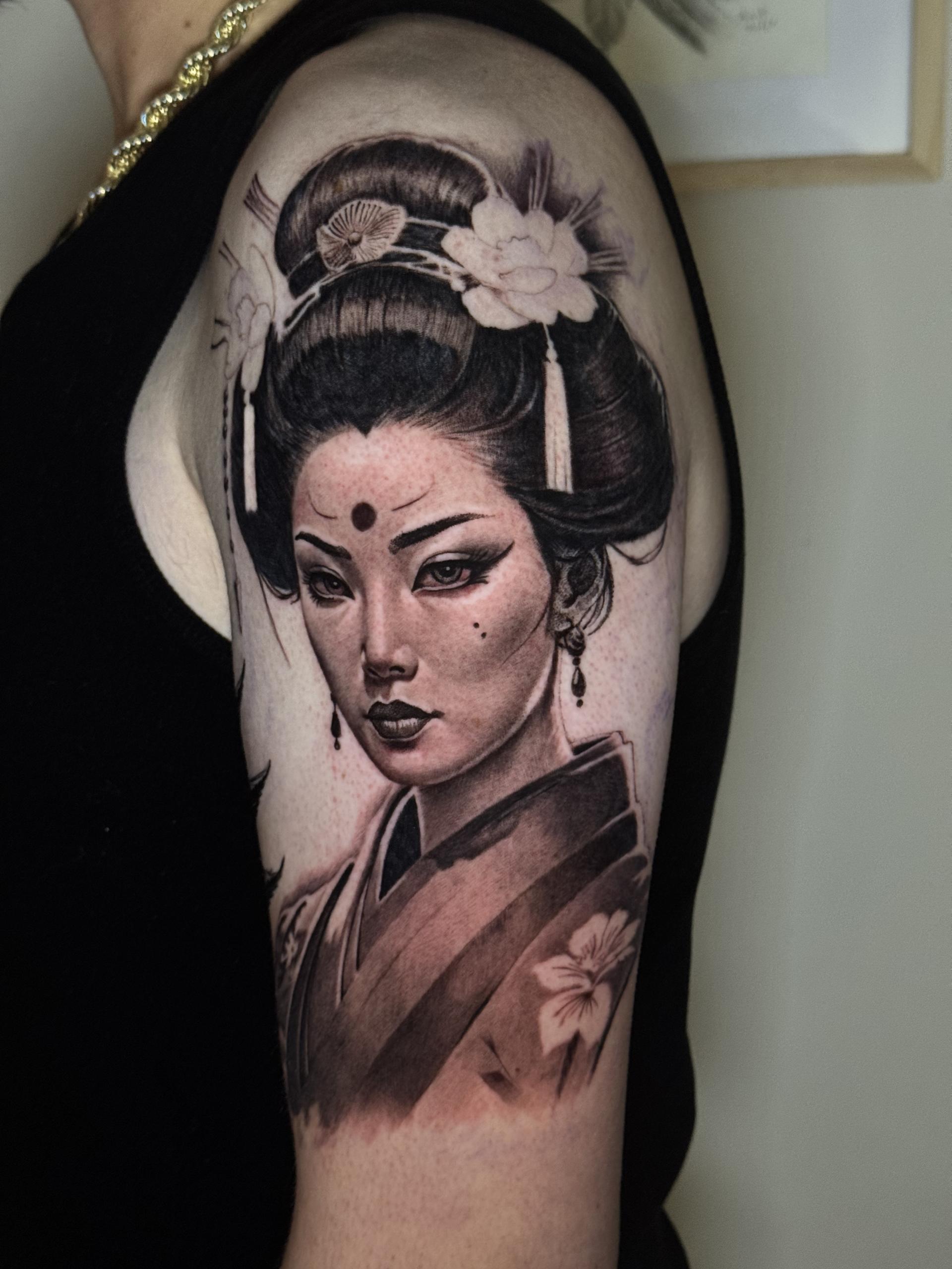 Geisha portrait on upper arm