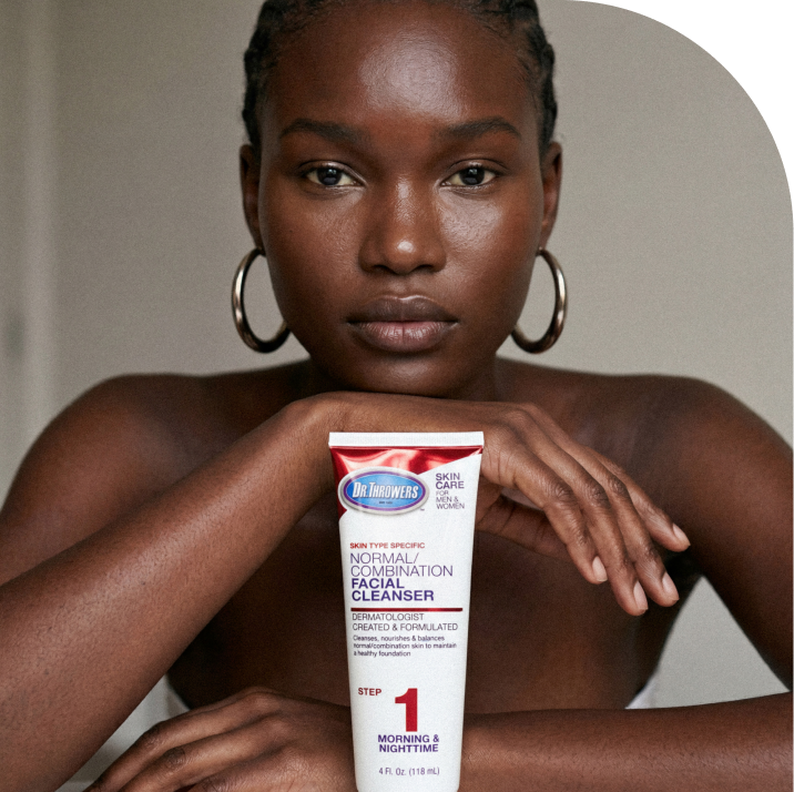 Woman holding Dr. Thrower's Normal/Combination Facial Cleanser