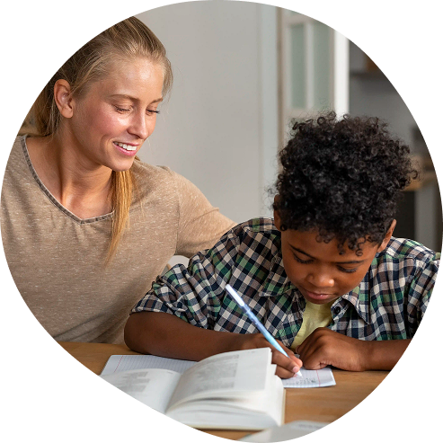 A teacher helping a student with his homework