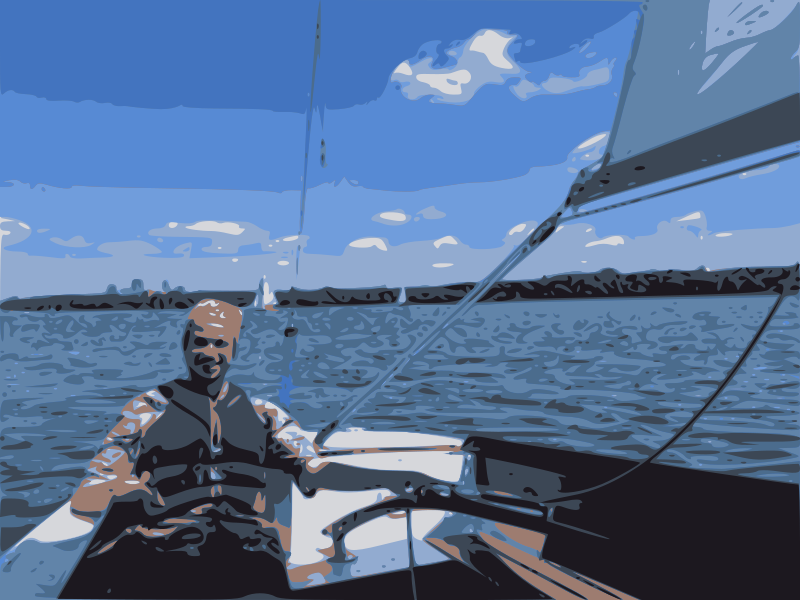 Heezy Klovaday at the tiller of a keelboat on Lake Bde Maka Ska