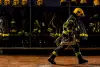 Firefighter walking through fire station