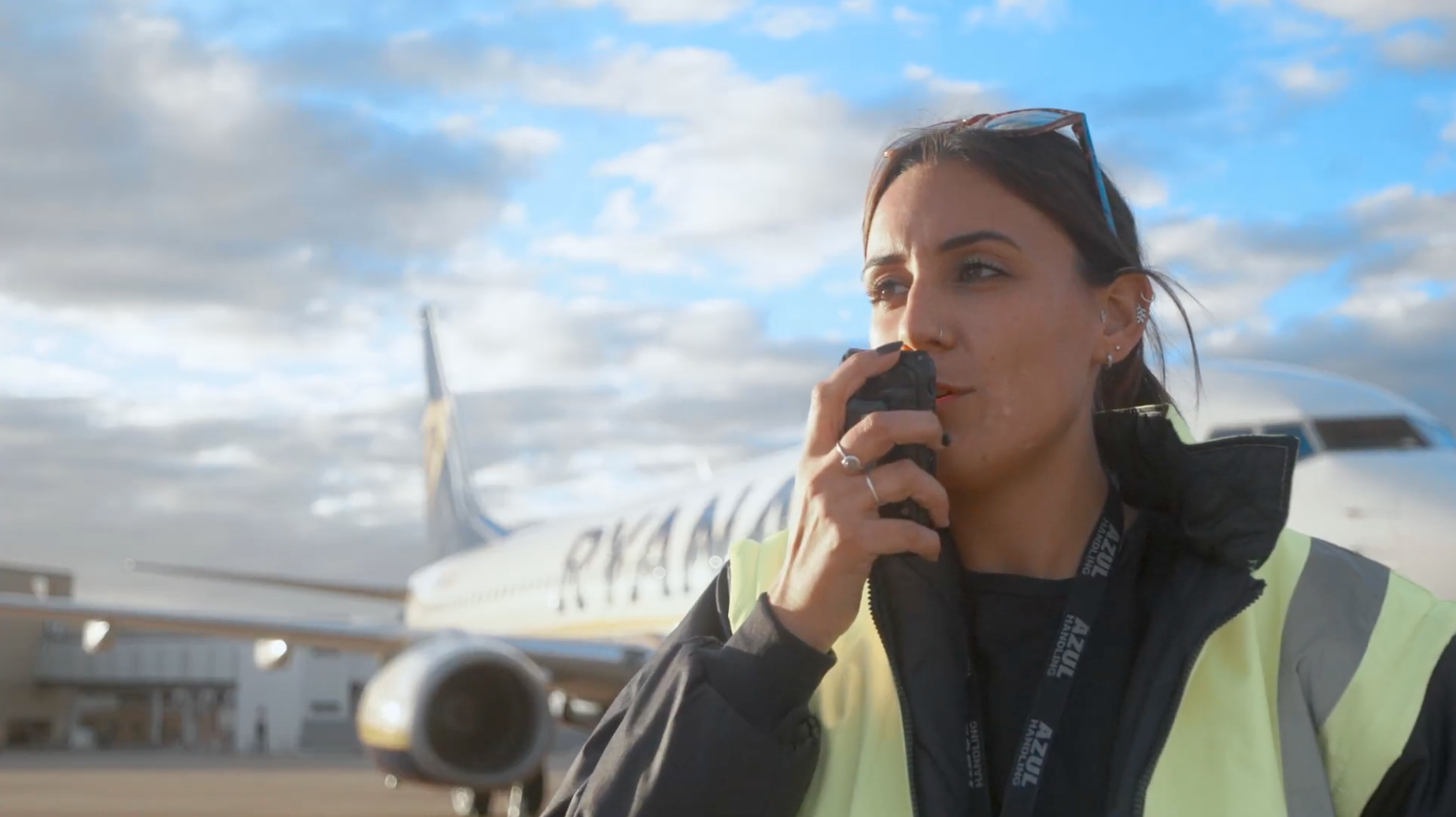 Aviation employee on the tarmac using Zello on a mobile device