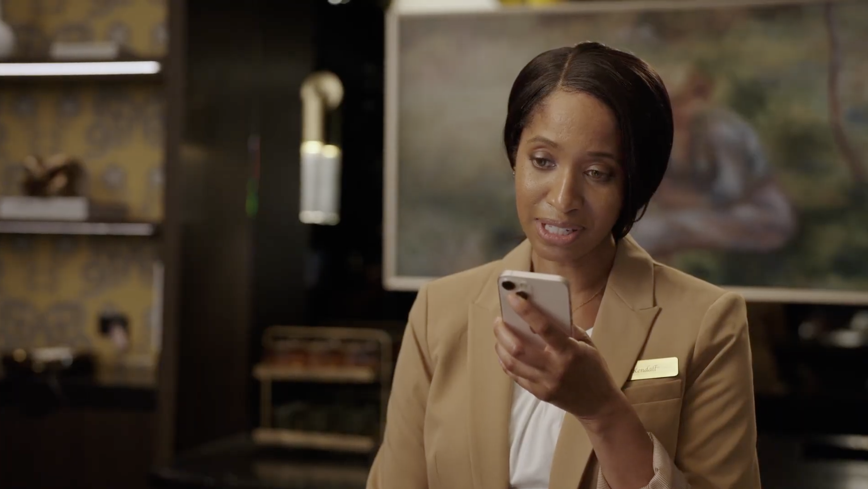 Photo of a hospitality worker using Zello on a mobile device