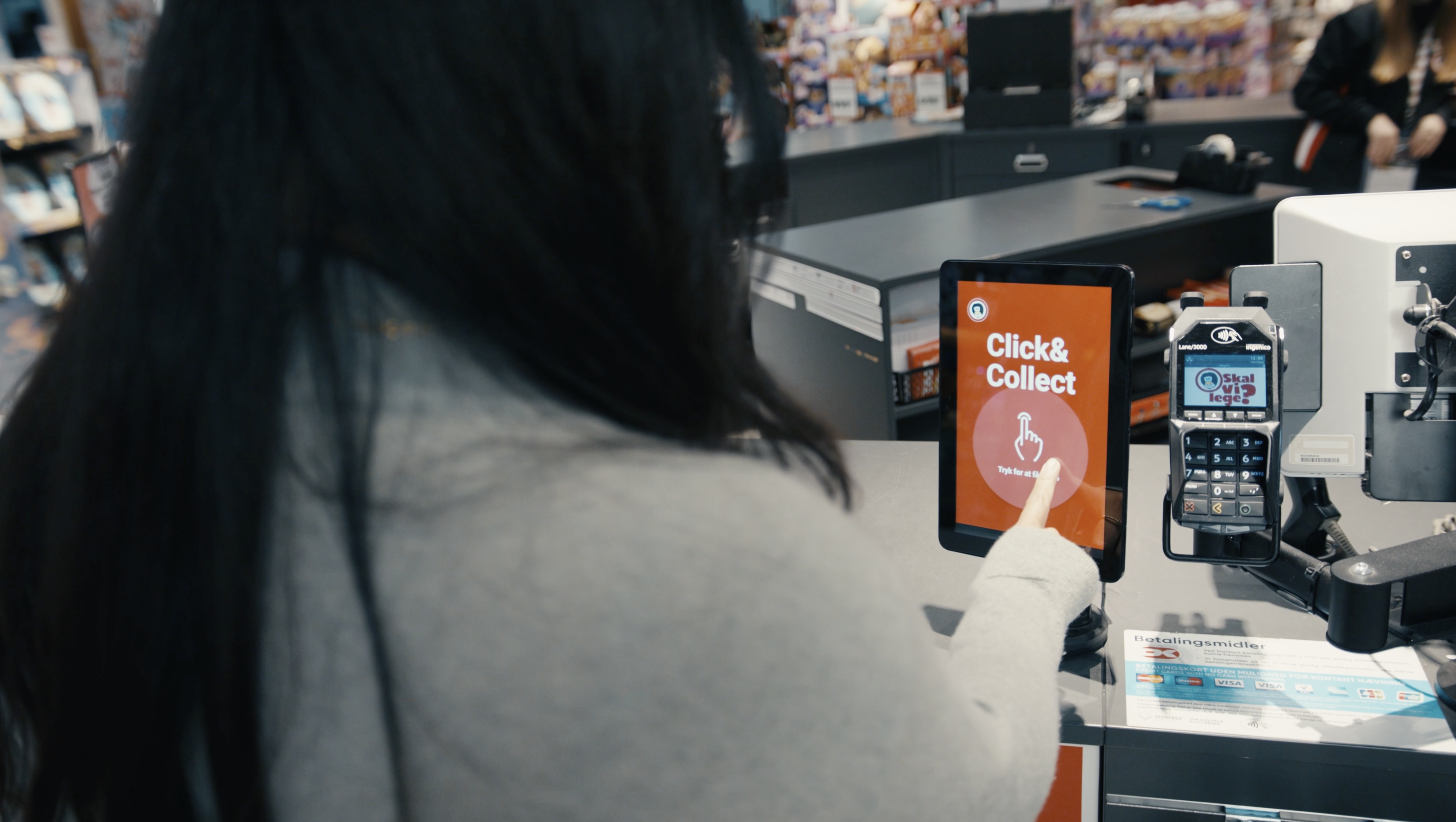 Photo of someone using Zello on a mobile device in a retail store