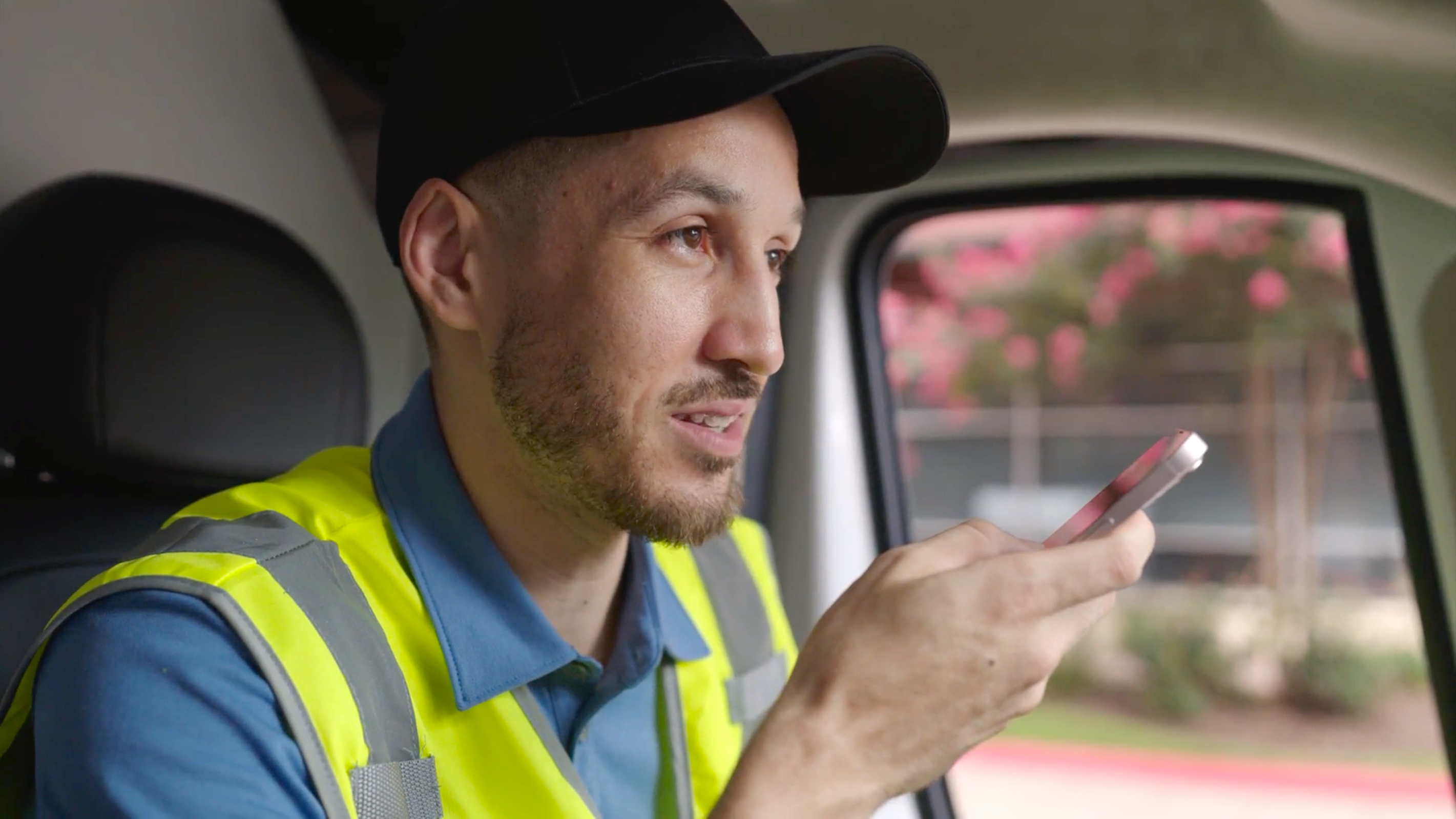 Photo of a truck driver using Zello on a mobile device