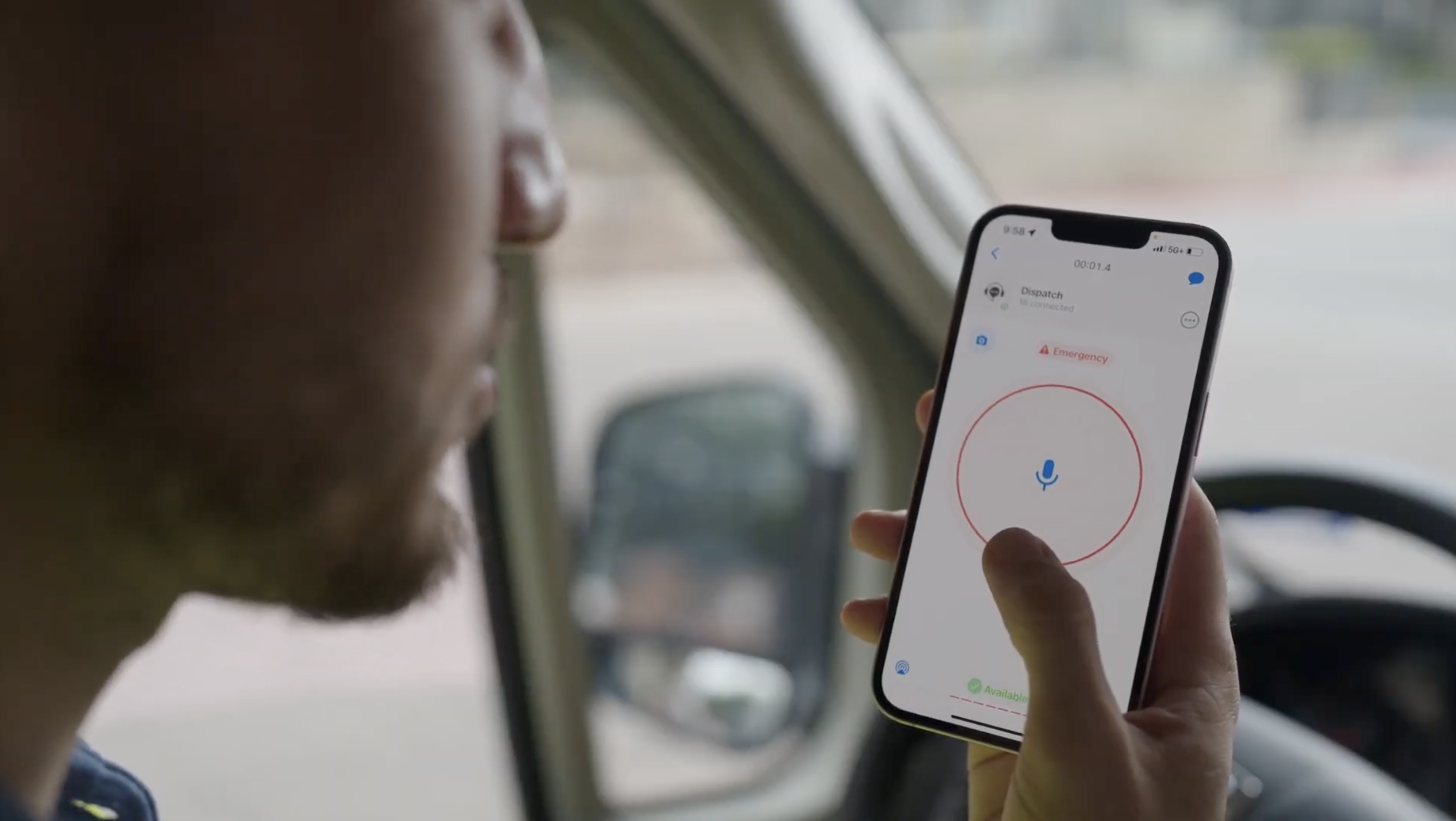 Photo of a truck driver using Zello on a mobile device