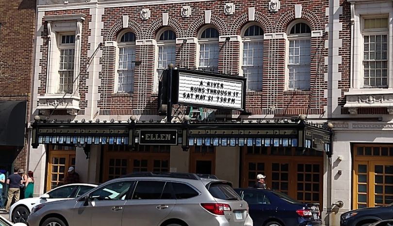 Car parked & peoples stand IN front of Ellen Theater