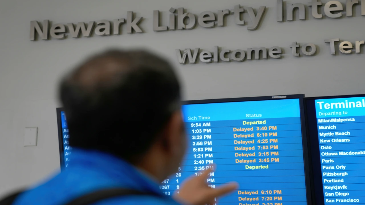 Travelers waiting during delays at EWR Airport