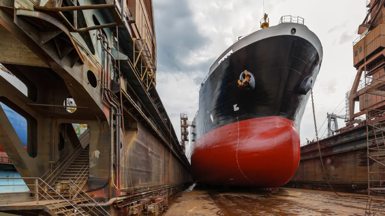 Cruise ship in dry dock undergoing maintenance & representing