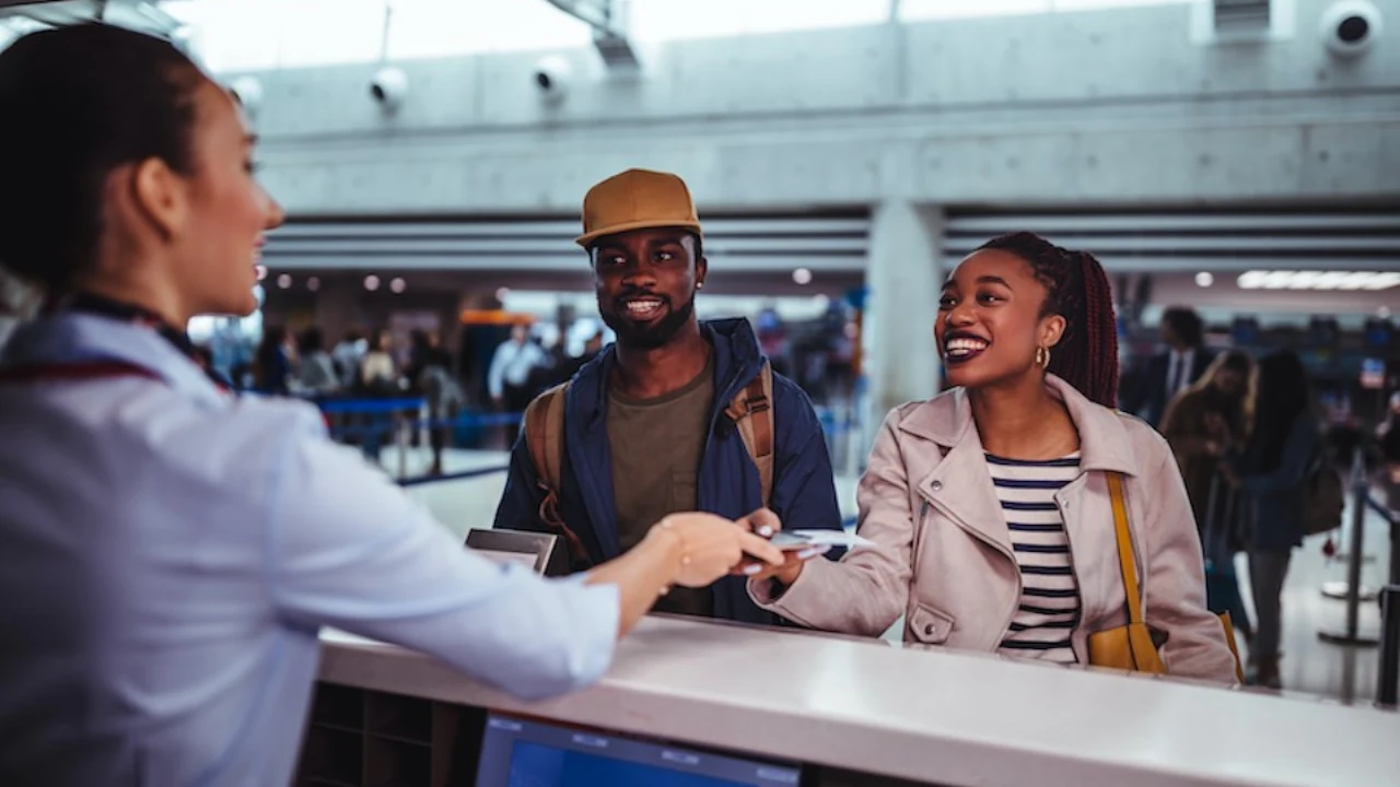 Passengers at WestJet Airlines airport check-in counter