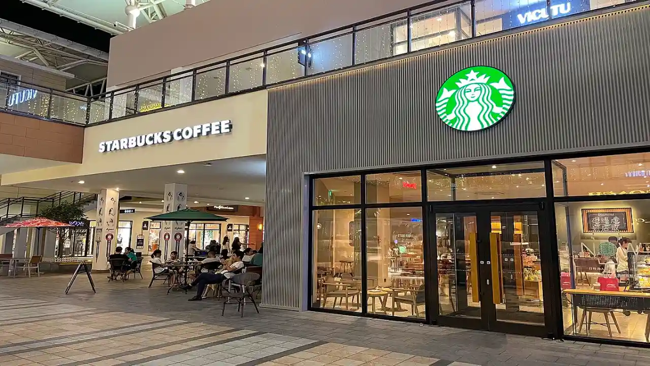 Travelers enjoying coffee at Starbucks Miami Airport