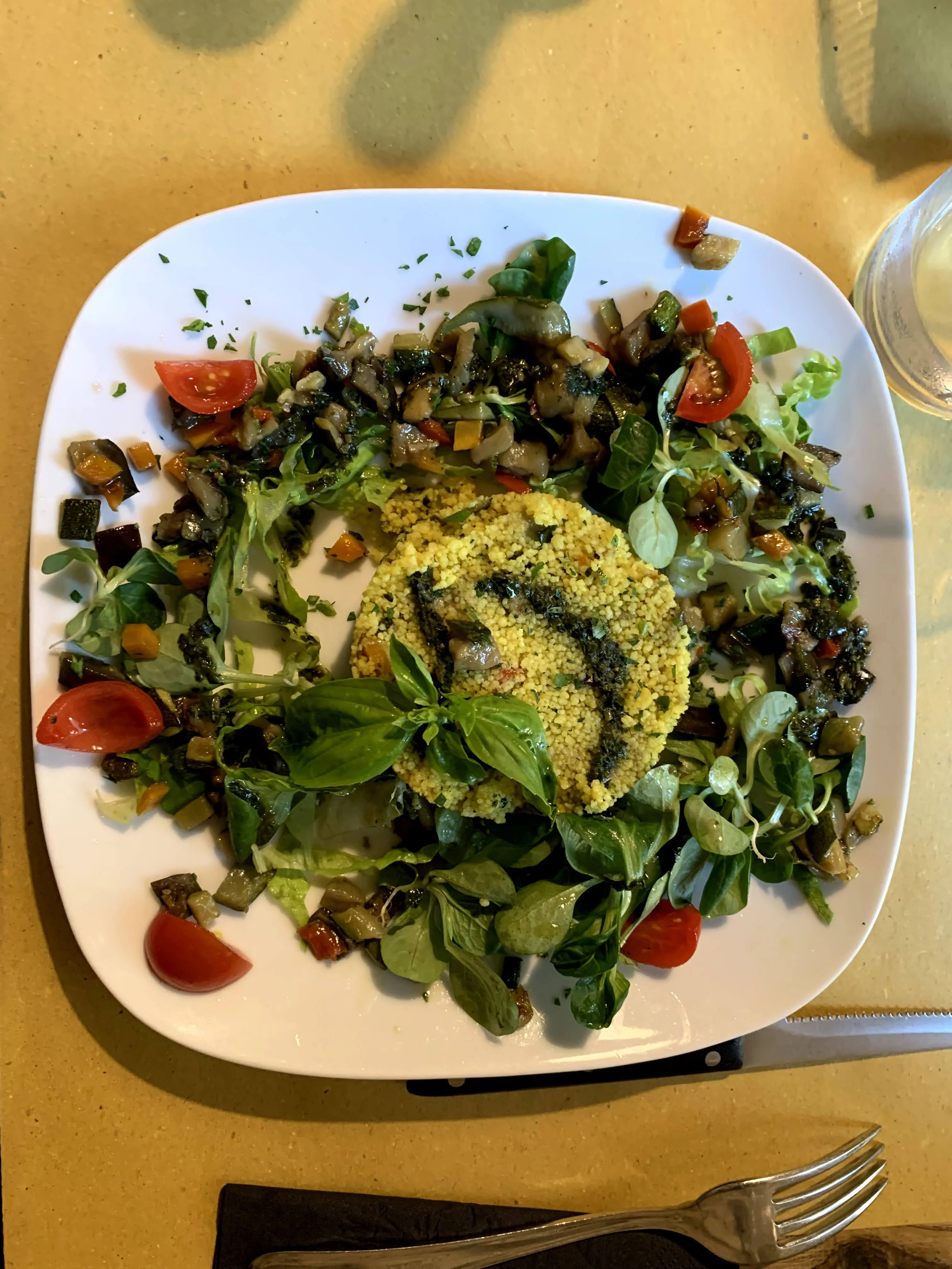 vegan-vegetable-couscous-with-eggplant-zucchini-fresh-tomatoes-peppers-lettuce-and-arugula