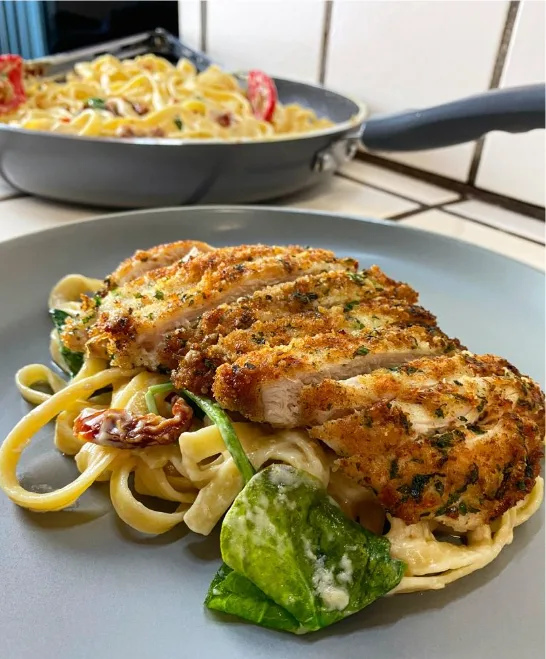 parmesan-chicken-over-spinach-alfredo-fettuccine