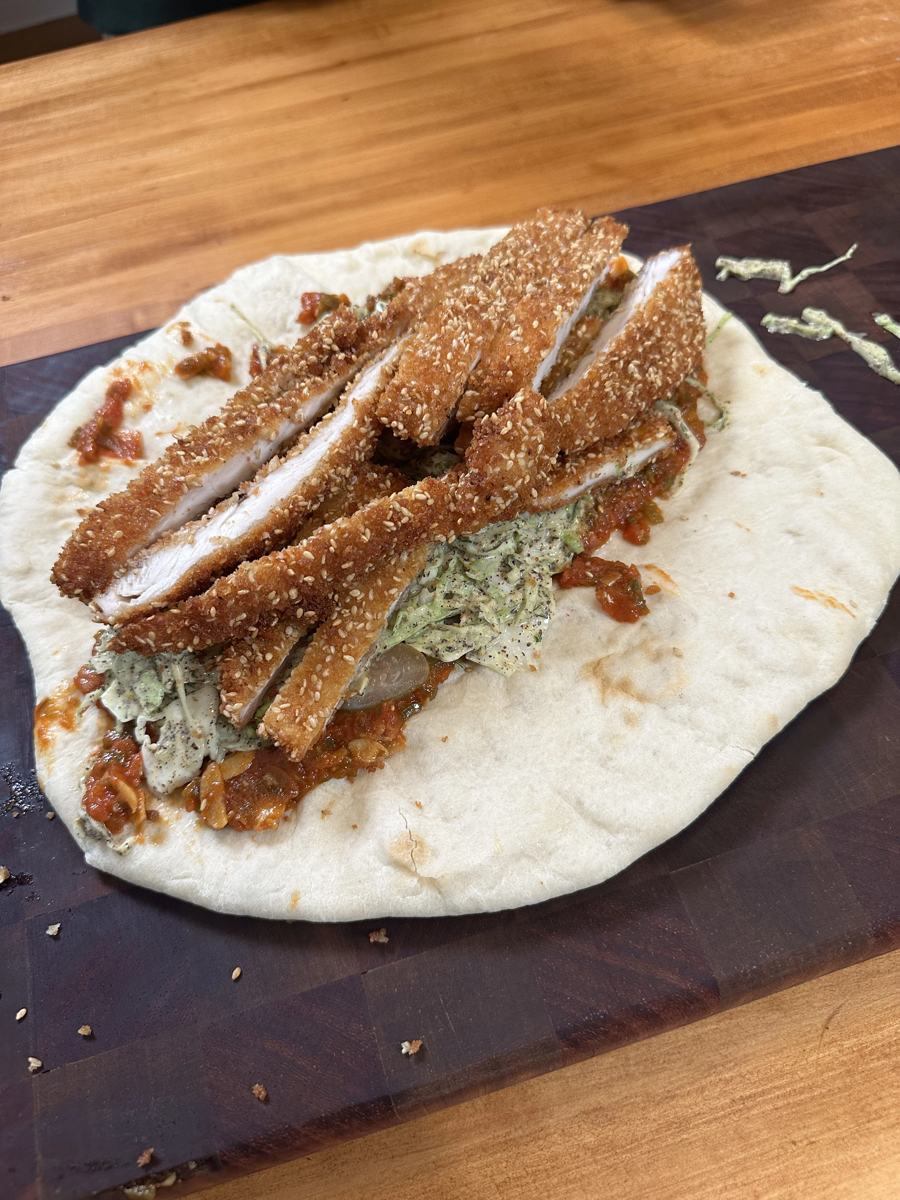 schnitzel-sandwich-with-matbucha-and-amba-slaw