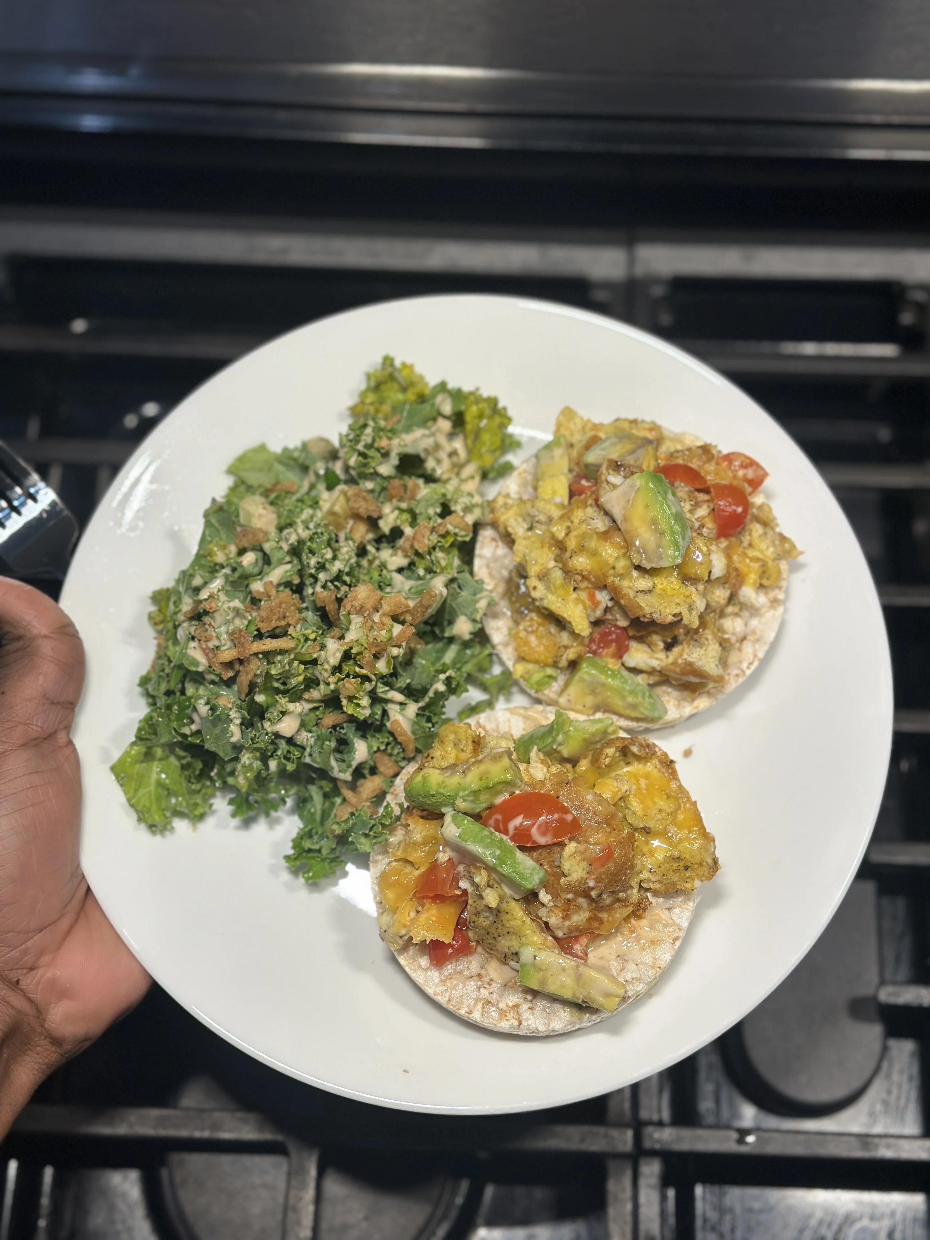 rice-cakes-topped-with-eggs-tomato-and-cheddar-cheese-with-kale-salad