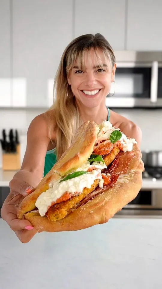 folded-pizza-sandwich-with-crispy-chicken-cutlets-prosciutto-mozzarella-burrata-hot-honey-and-parm