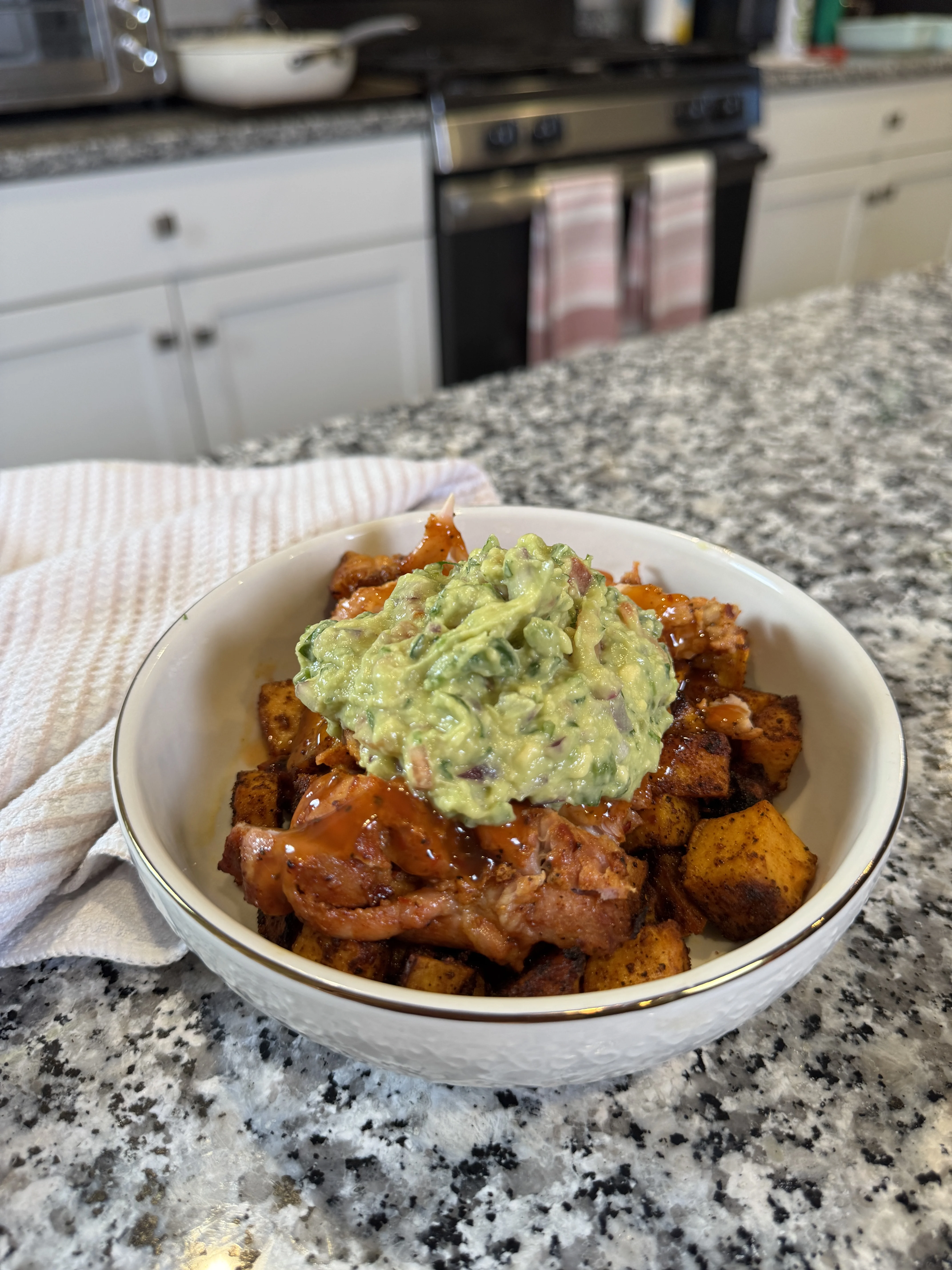 roasted-sweet-potatoes-and-juicy-chicken-thighs-topped-with-homemade-guacamole
