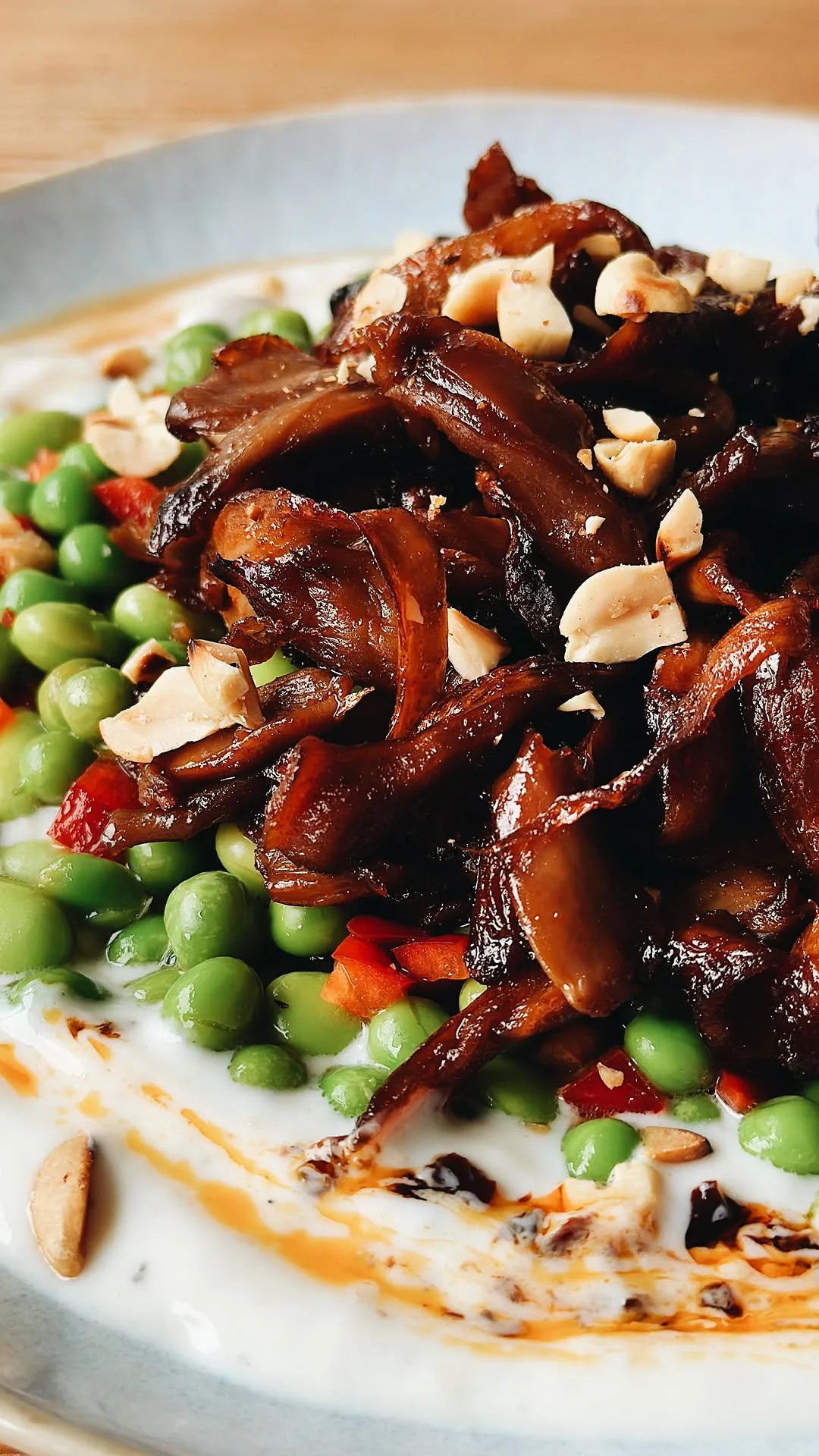 pulled-oyster-mushrooms-with-pea-and-edamame-asian-salad-on-a-bed-of-garlic-yoghurt