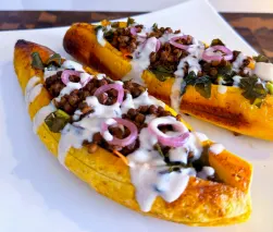 fermented-callaloo-and-lentil-stuffed-baked-plantains-with-coconut-tahini-sauce