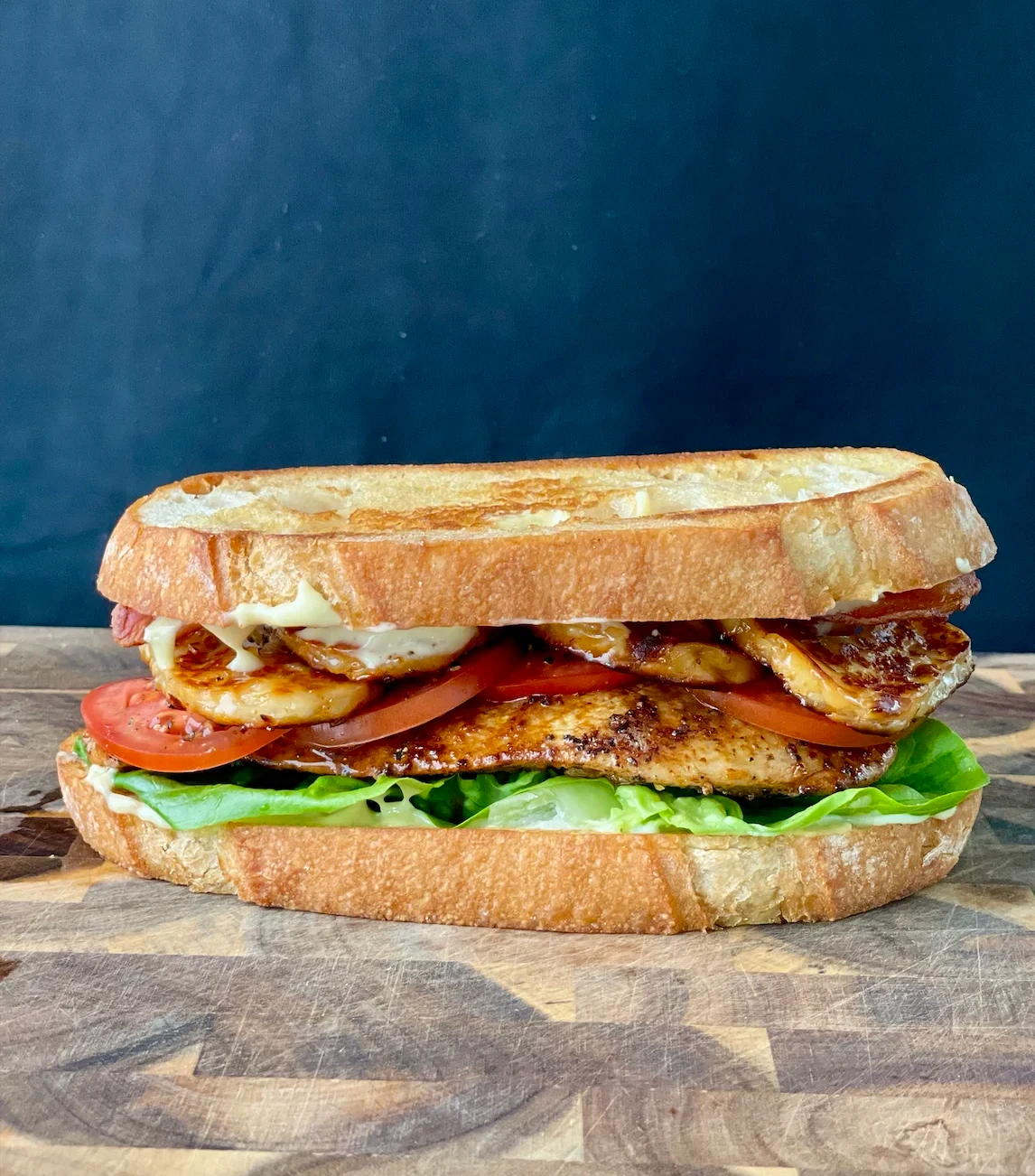 club-sandwich-with-hot-honey-halloumi-and-roasted-garlic-truffle-mayo