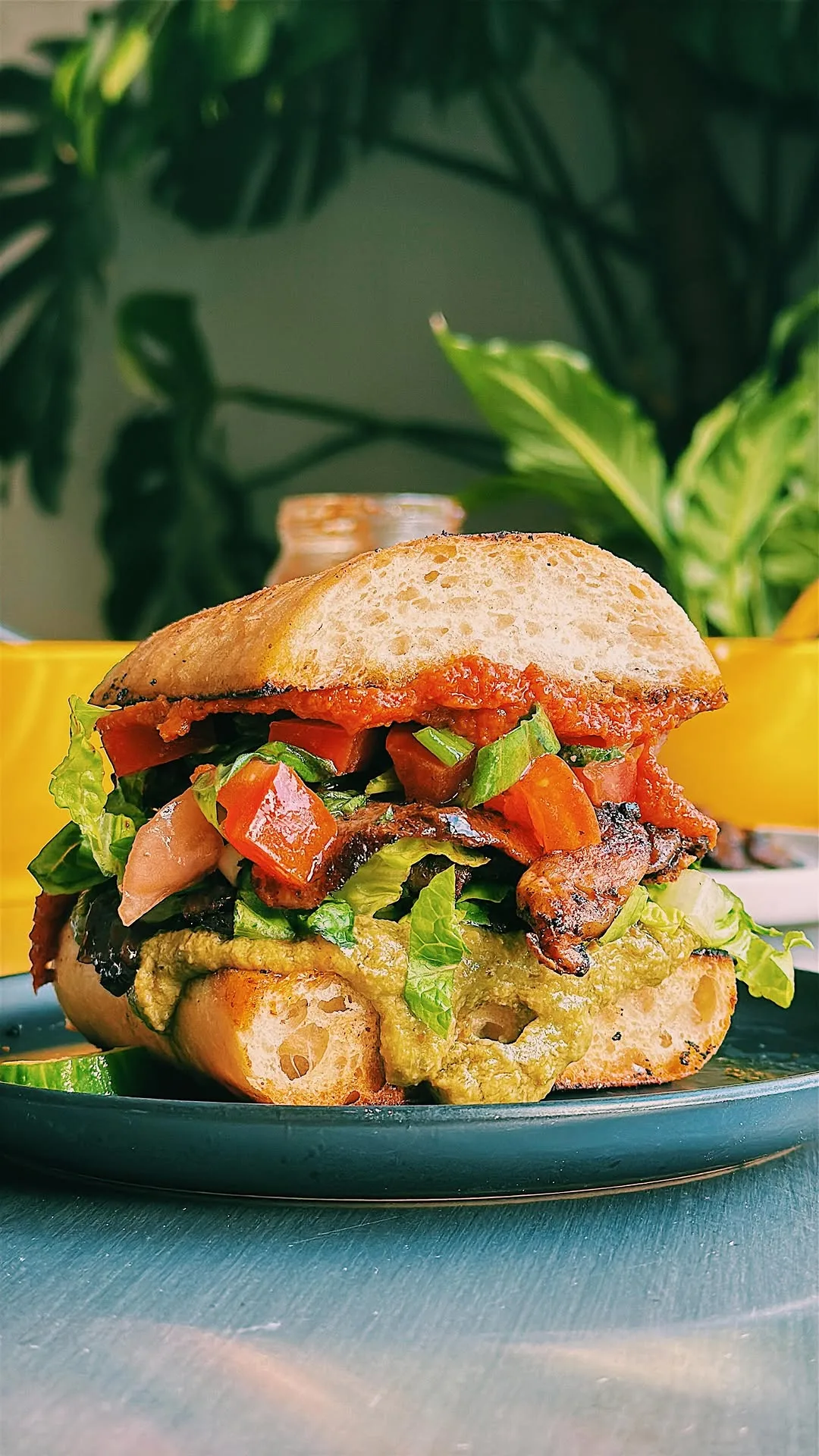 mushroom-shawarma-pesto-tahini-sun-dried-tomato-paste-chilli-jam-tomato-salad-in-a-ciabatta