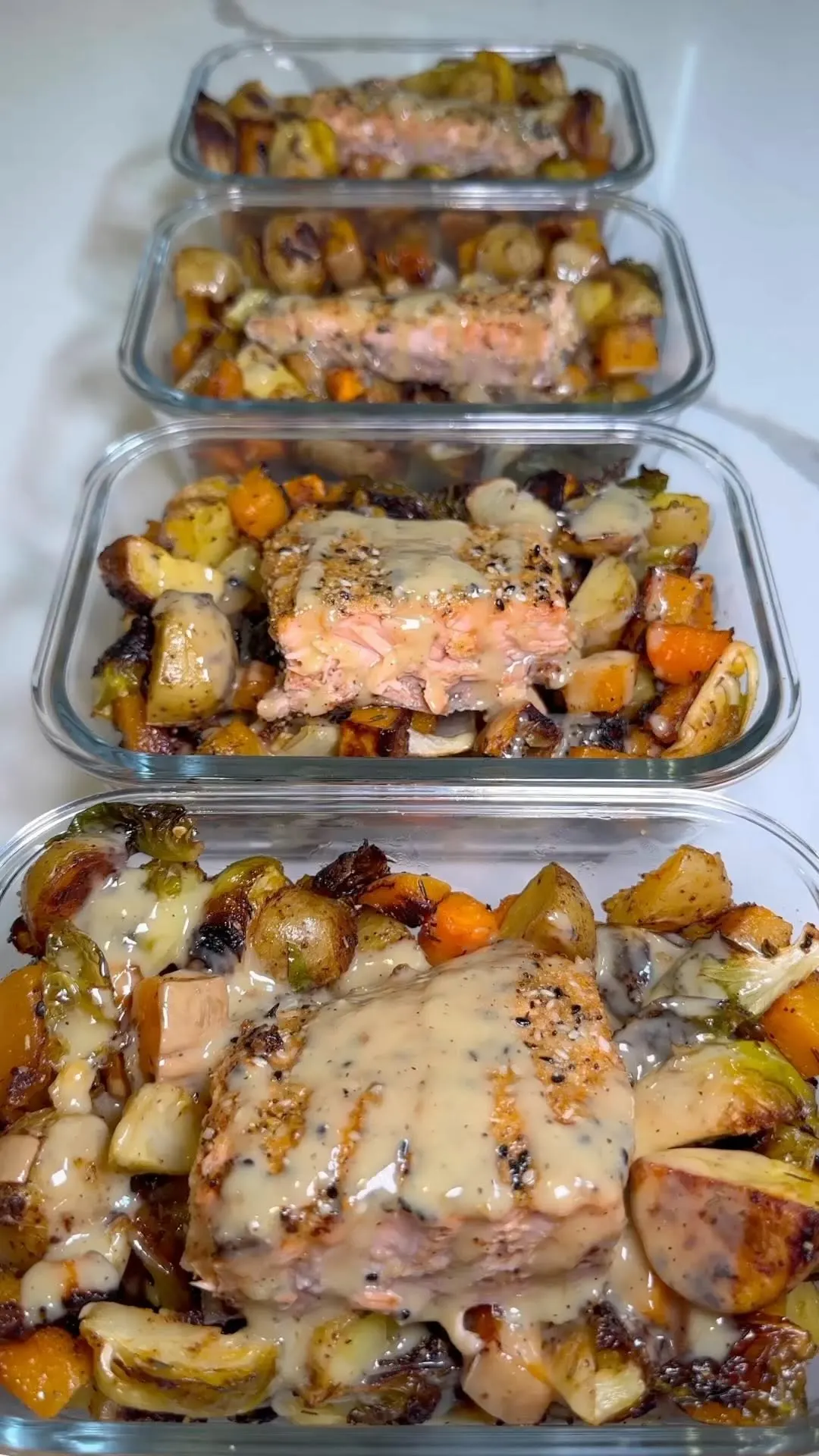 seasoned-salmon-with-roasted-potatoes-and-vegetables-and-a-maple-tahini-sauce