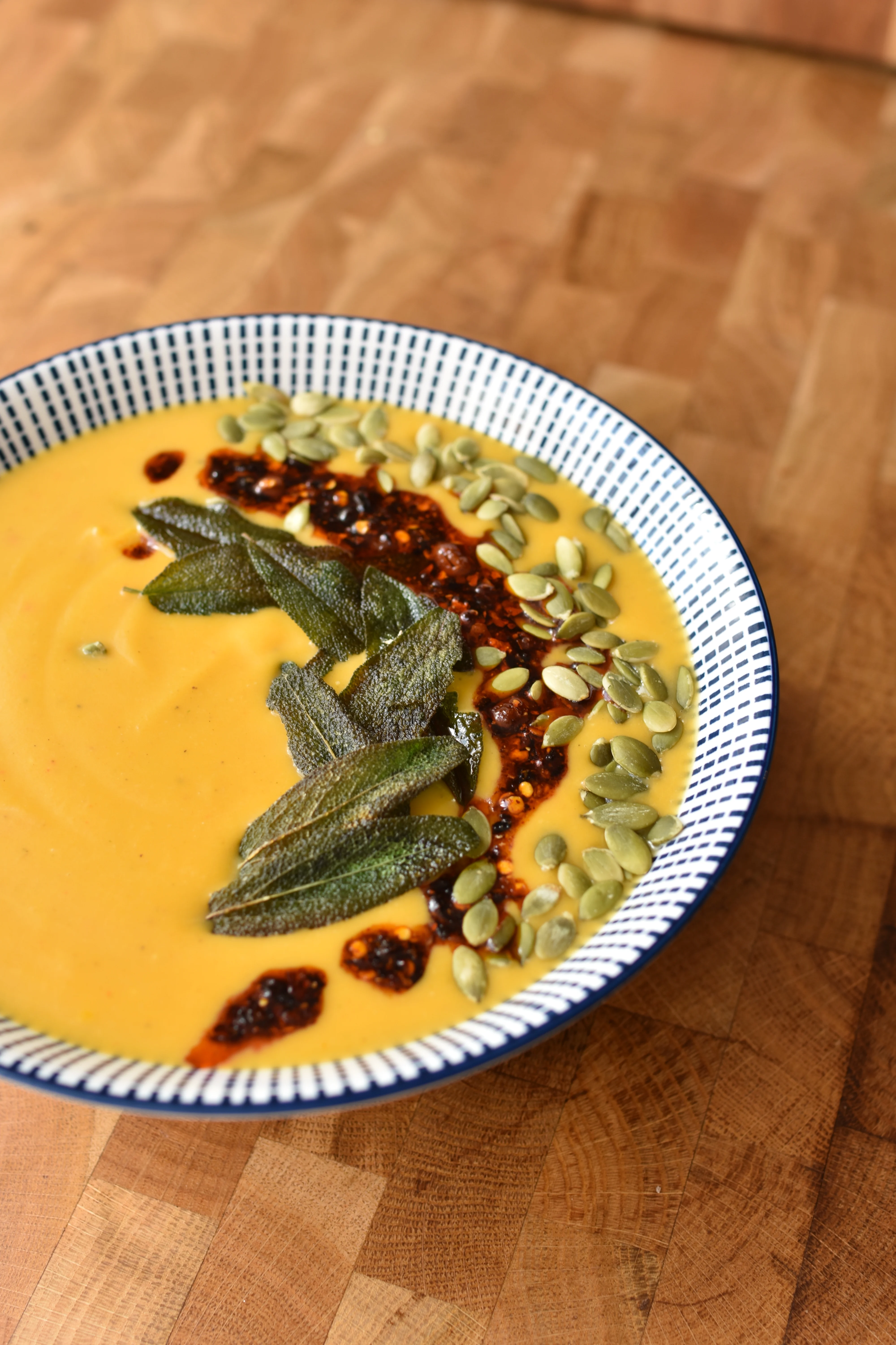 roasted-pumpkin-and-coconut-soup-with-chili-oil-and-crispy-sage