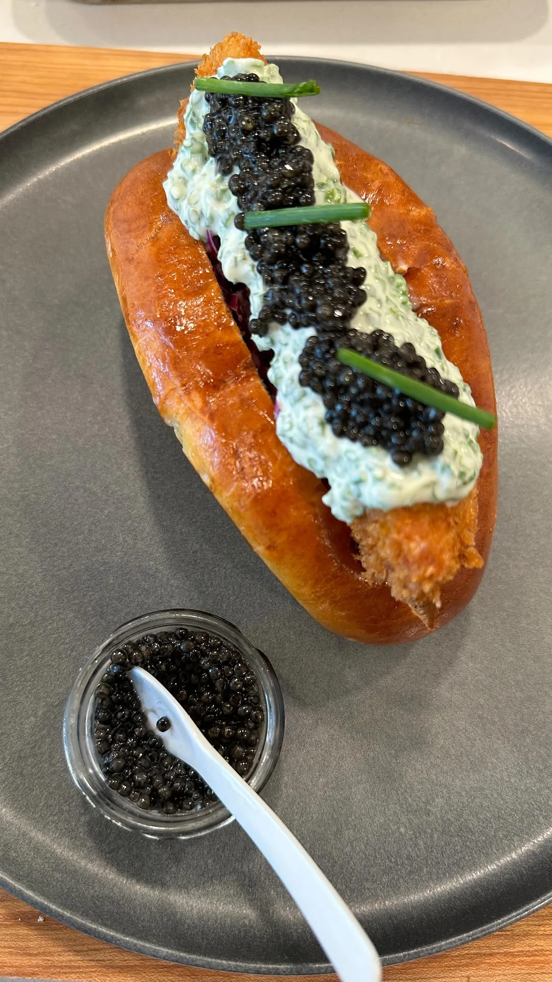 fried-chicken-caviar-and-creme-fraiche-on-a-potato-bun