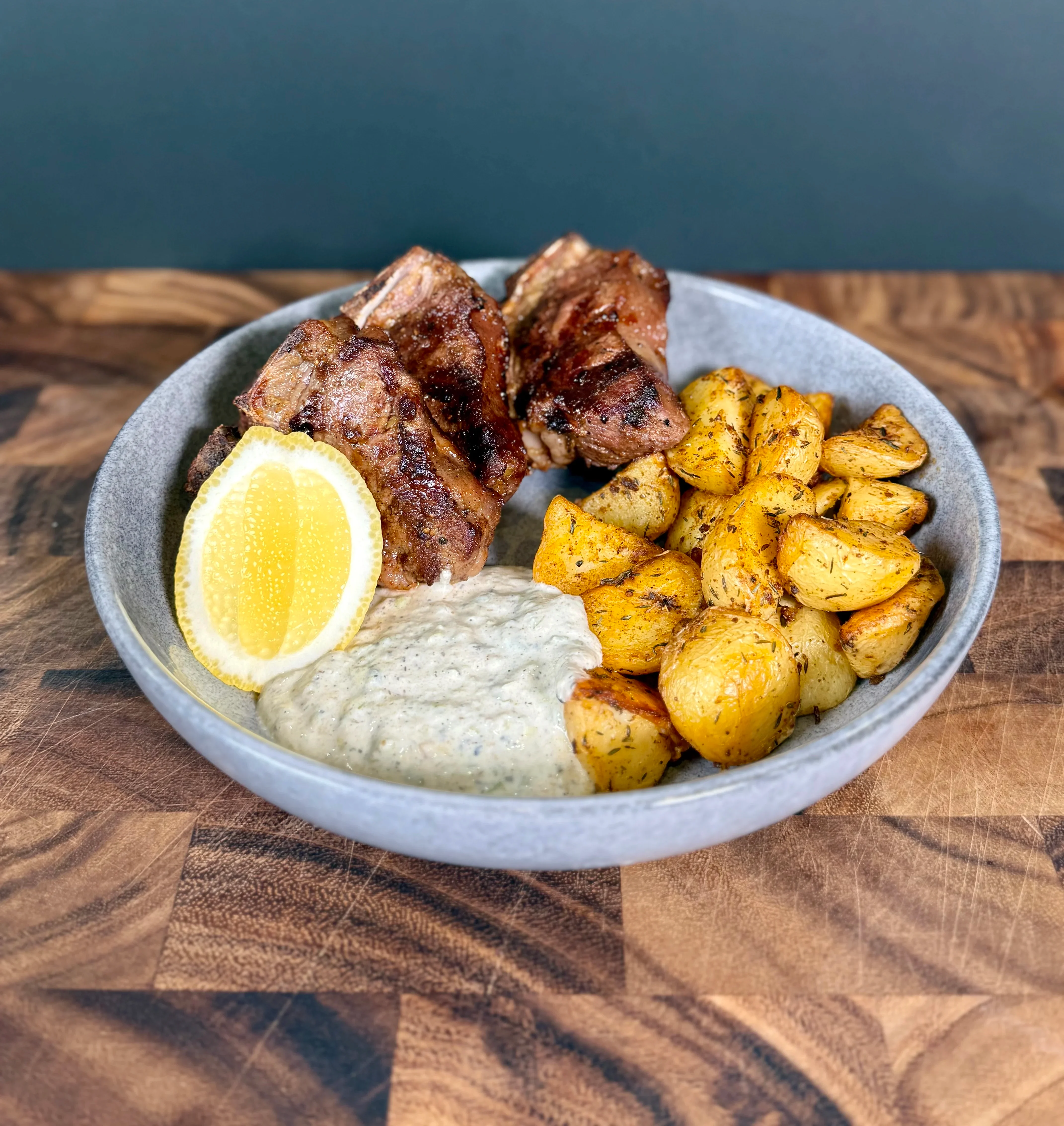 spiced-lamb-loin-chops-with-charred-spring-onion-yoghurt-and-roast-potatoes