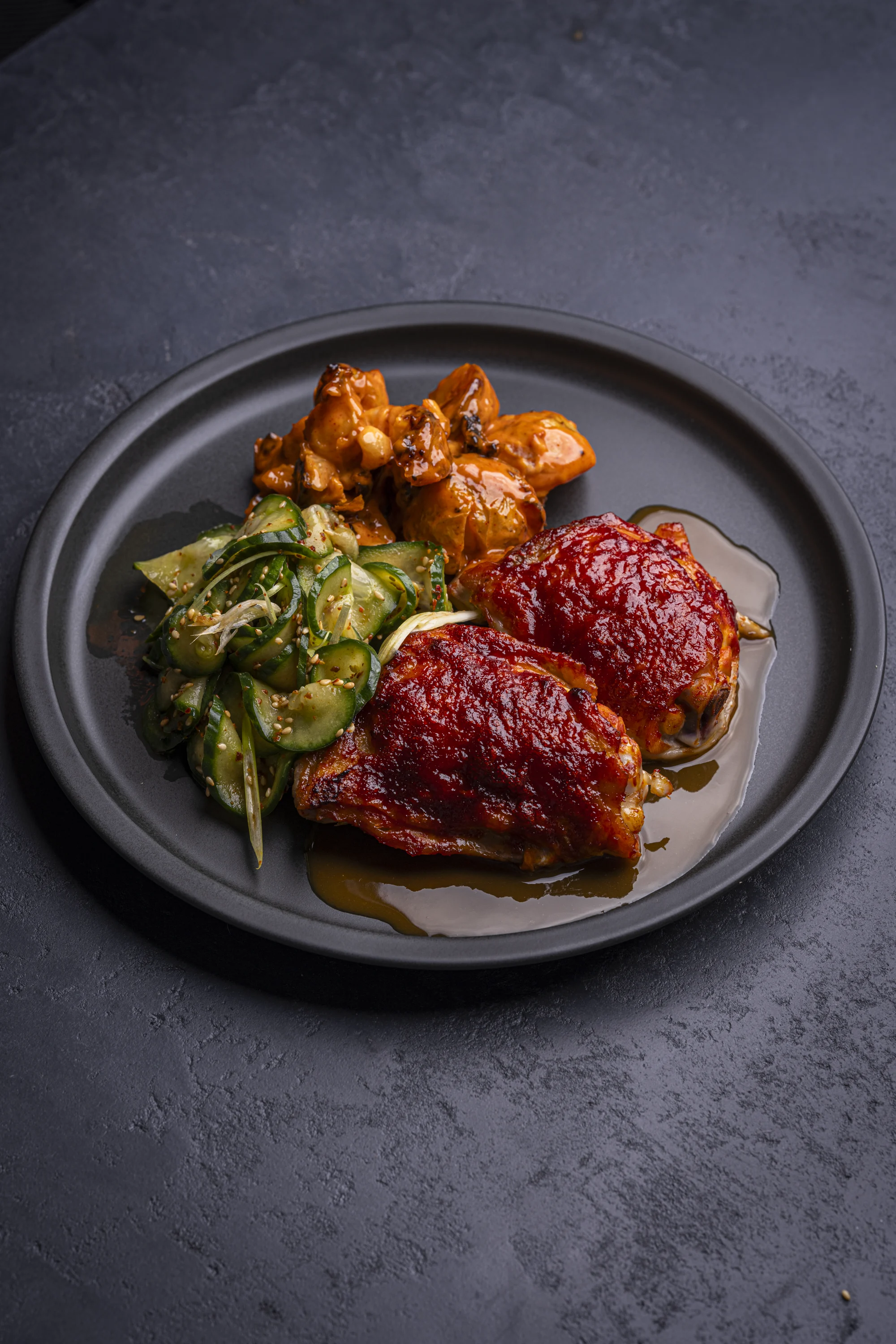 gochujang-chicken-thighs-and-soju-pan-sauce-crushed-roasted-potato-salad-with-gochujang-mayo-and-quick-pickled-cucumber-salad-with-gochugaru