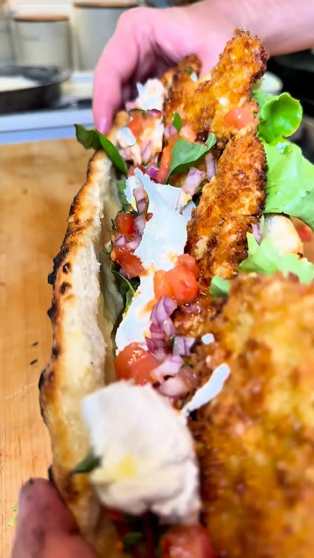 fried-chicken-tenders-cutlet-pizza-sandwich-with-fresh-mozzarella-and-tomato-salad