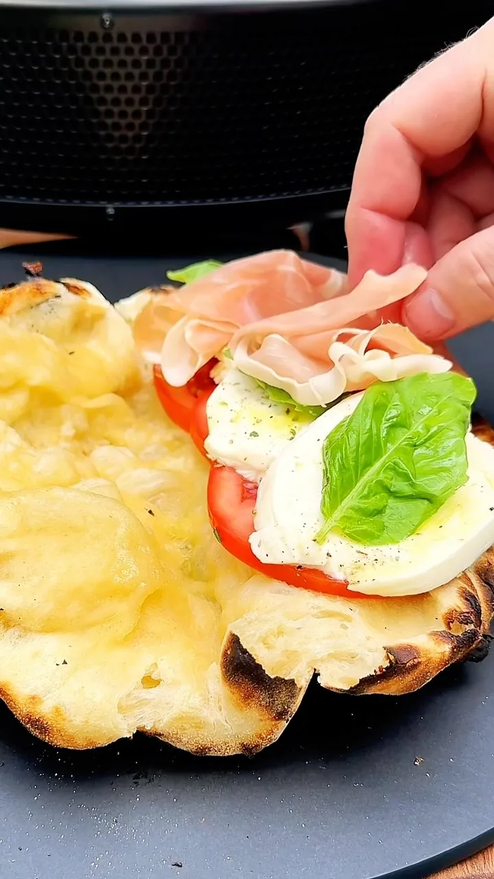 prosciutto-marinated-tomato-fresh-mozzarella-and-basil-pizza-sandwich-on-sourdough-crust