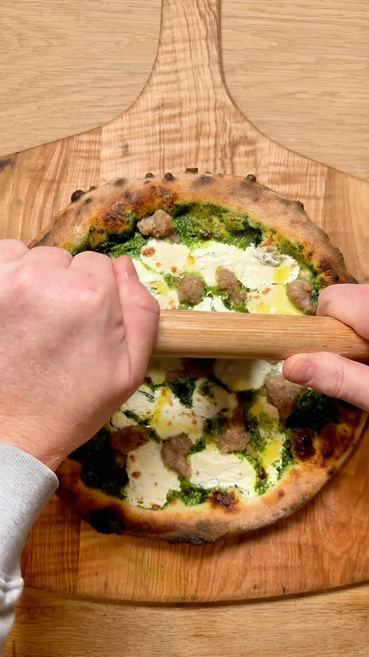 crispy-sourdough-pizza-with-creamed-spinach-base-whipped-basil-ricotta-mozzarella-and-fennel-sausage