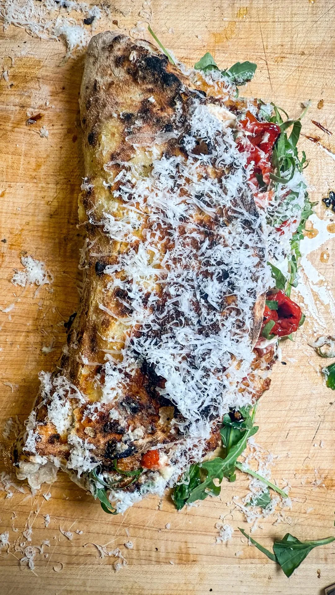 thin-panko-crusted-pork-cutlets-topped-with-roasted-peppers-and-burrata-served-on-a-bed-of-lemony-arugula-with-olive-oil-reduced-balsamic-and-a-generous-shaving-of-parmigiano-reggiano