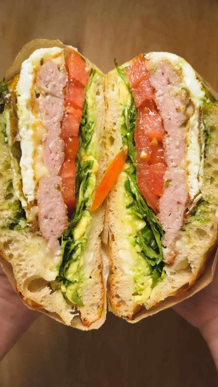 sausage-egg-avocado-and-pesto-breakfast-sandwich-on-sourdough-focaccia