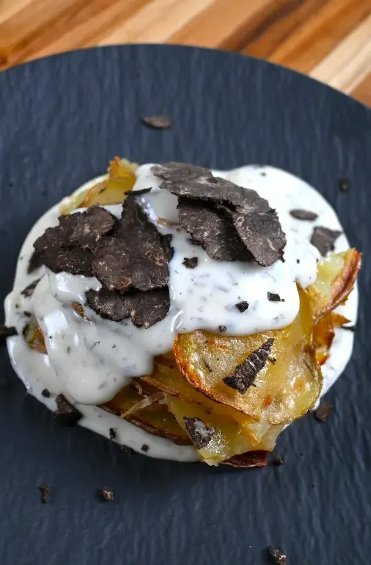 potato-millefoglie-with-cheese-fondue-and-fresh-black-truffle