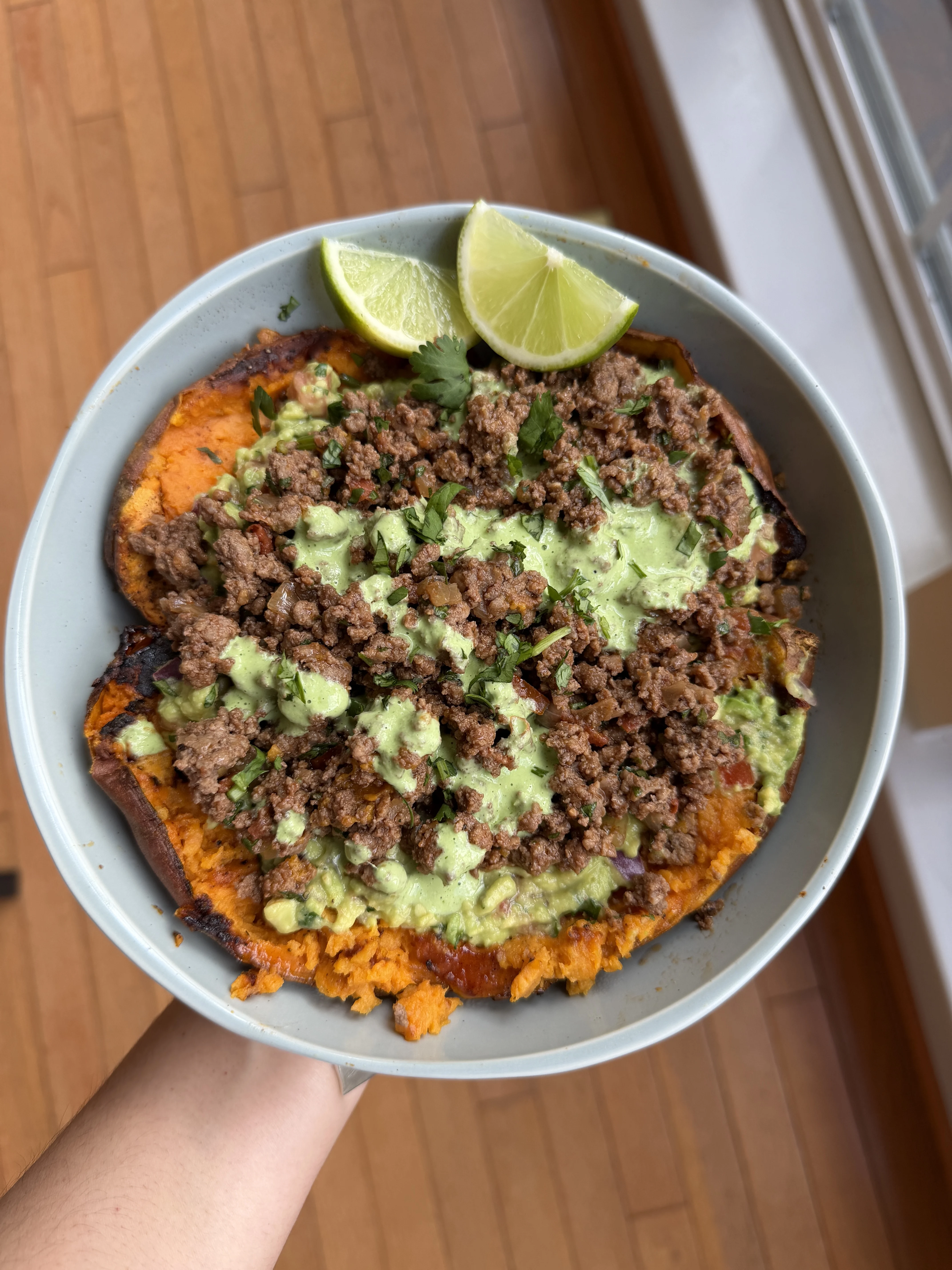 loaded-sweet-potato-with-ground-beef-avocado-mash-and-a-cilantro-crema-drizzle
