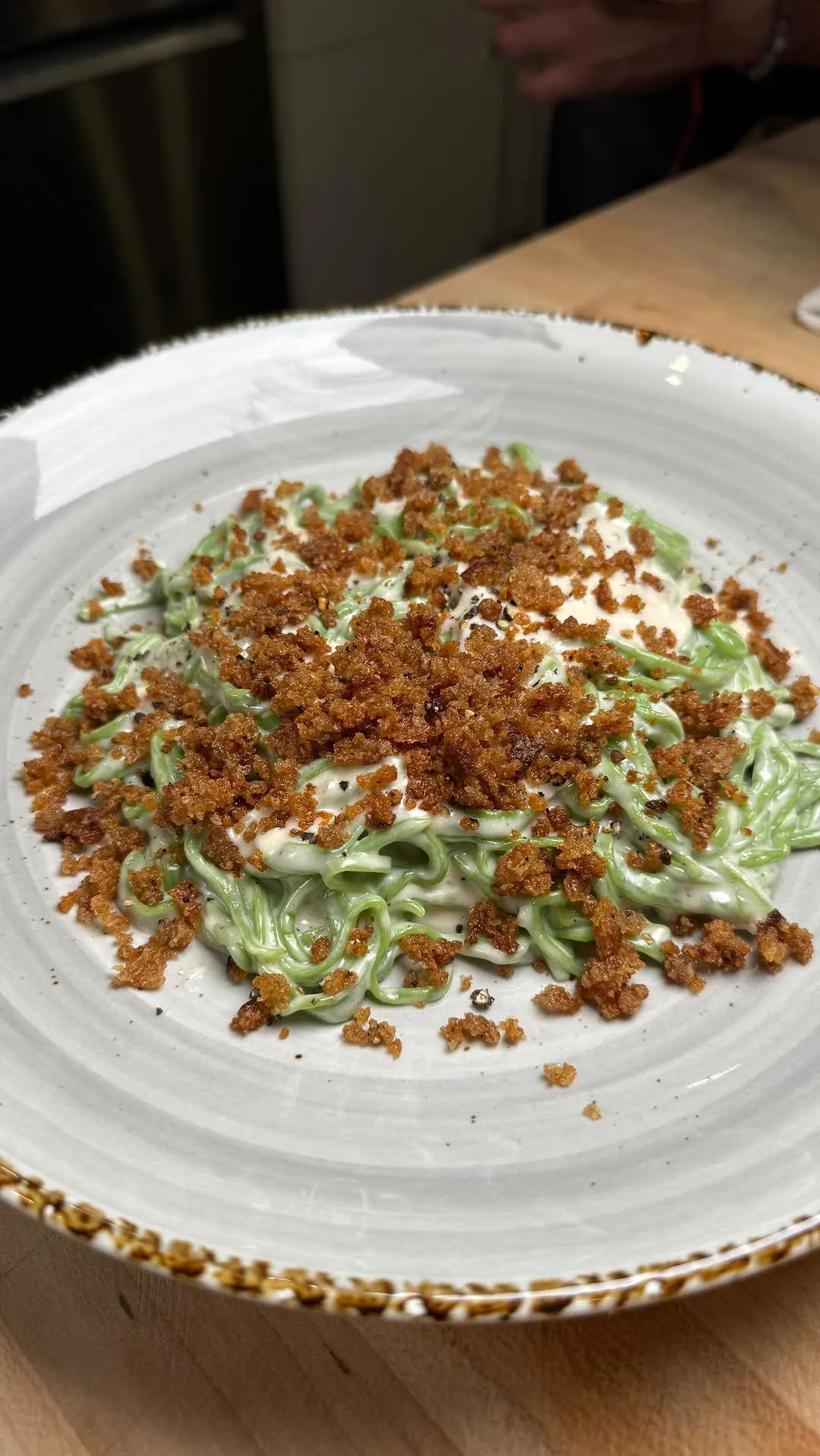 fresh-spinach-pasta-with-alfredo-sauce-and-sourdough-bread-crumbs