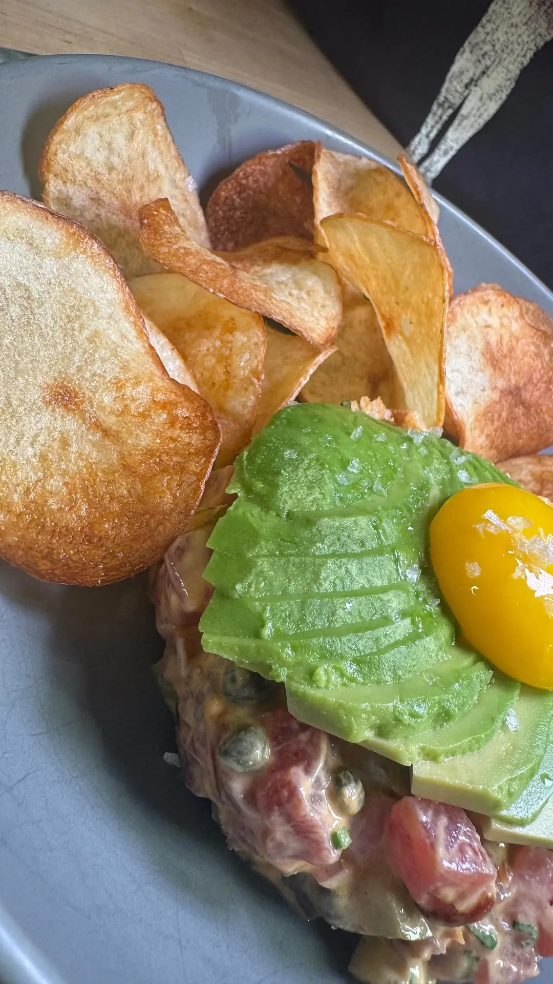 blue-fin-tuna-tartare-with-gochujang-sesame-sauce-yukon-gold-potato-chips-avocado-and-egg-yolk