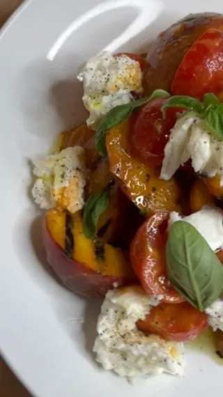 charred-yellow-peach-salad-with-summer-vine-tomato-mozzarella-tomato-vinaigrette-and-basil