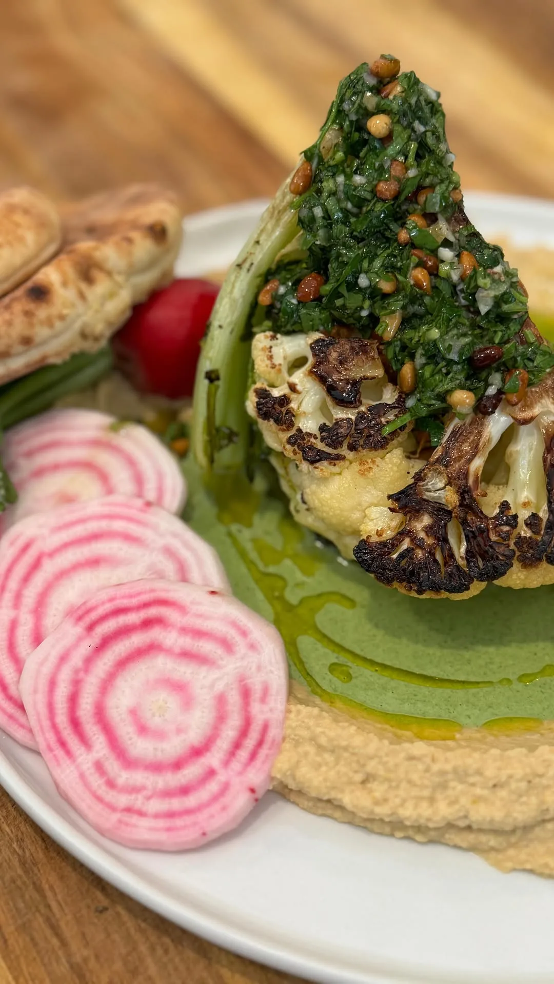 cauliflower-with-mesabecha-hummus-green-tahini-and-pine-nut-gremolata