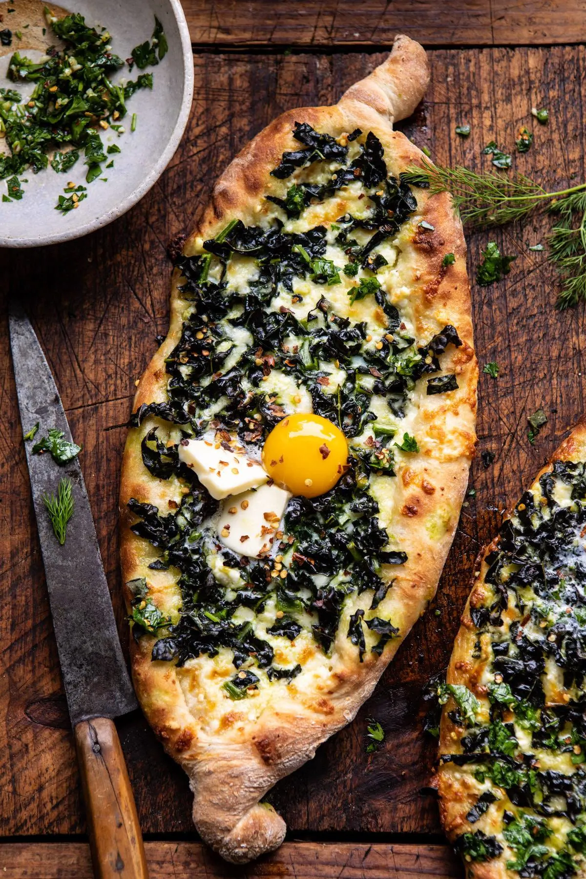 khachapuri-(georgian-cheese-bread)-with-kale-and-herby-garlic-sauce.