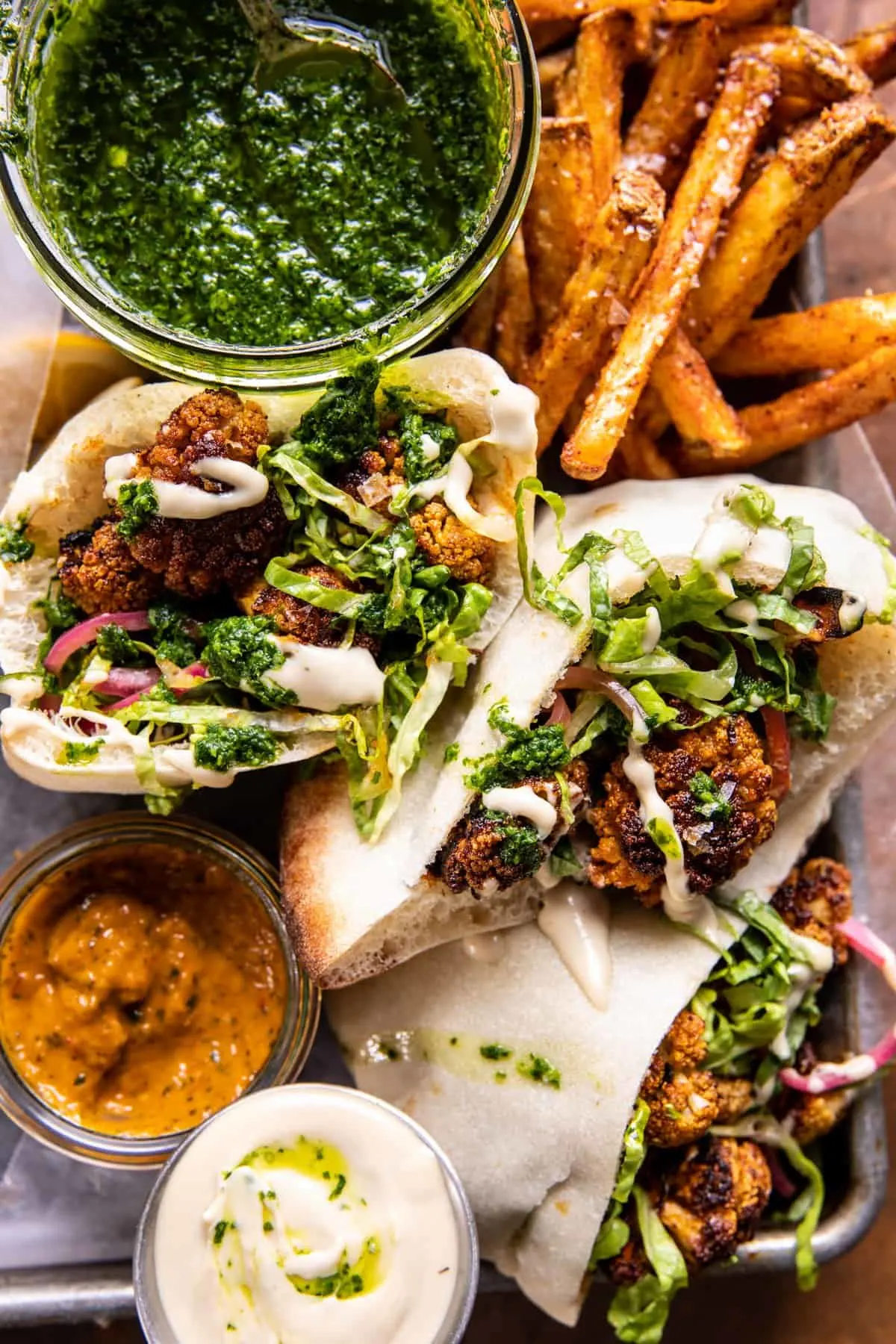 roasted-cauliflower-pitas-with-zhug-and-garlic-tahini