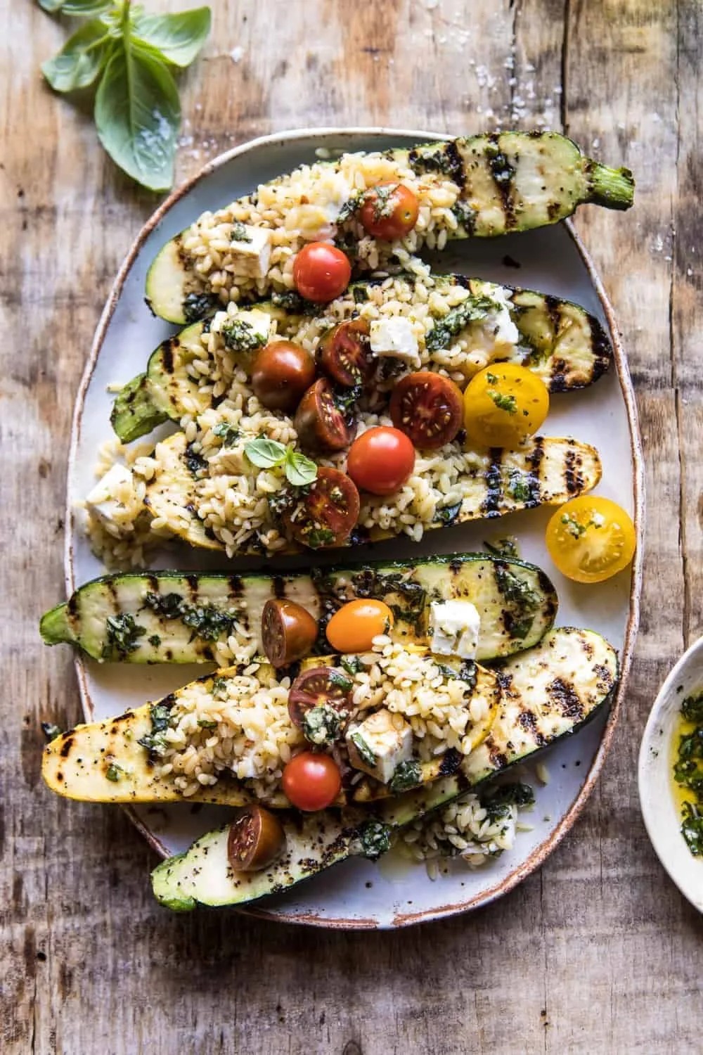 grilled-pesto-zucchini-stuffed-with-tomatoes-and-orzo