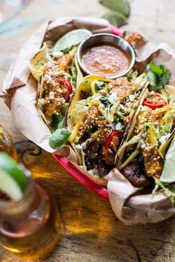 bulgogi-bbq-pork-tacos-with-charred-tomatillo-sesame-sauce-spring-onion-slaw.